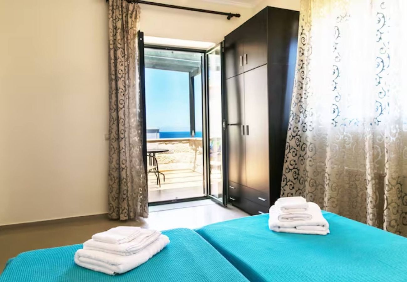 Bedroom with balcony and sea view at Villa Alexandra Stavros Crete