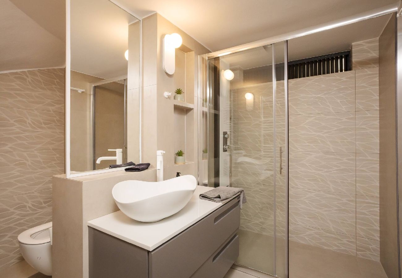 Bathroom with rainfall shower at Demi apartment in Chania