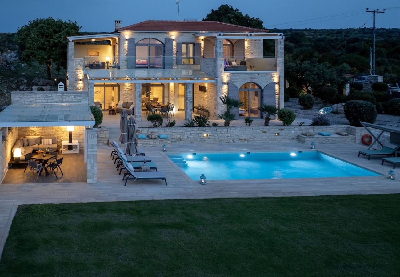 Luxury villa in Prines Rethymno with private illuminated pool at night