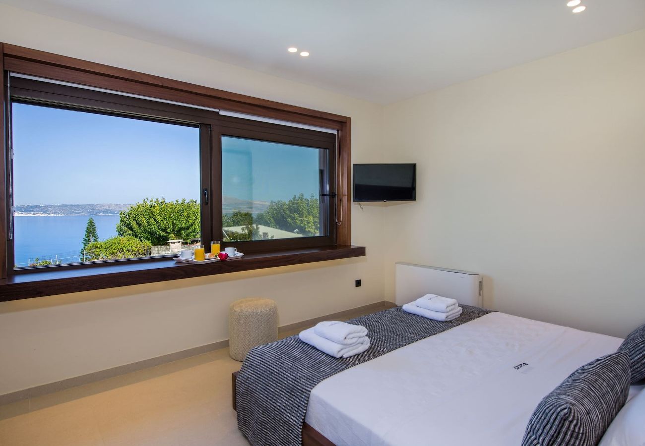 Sea view bedroom at Almi Cove Villa I in Almyrida