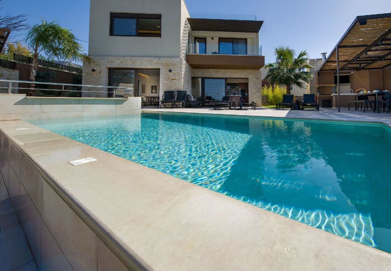 Private heated pool with sunbeds at Almi Cove Villa Crete