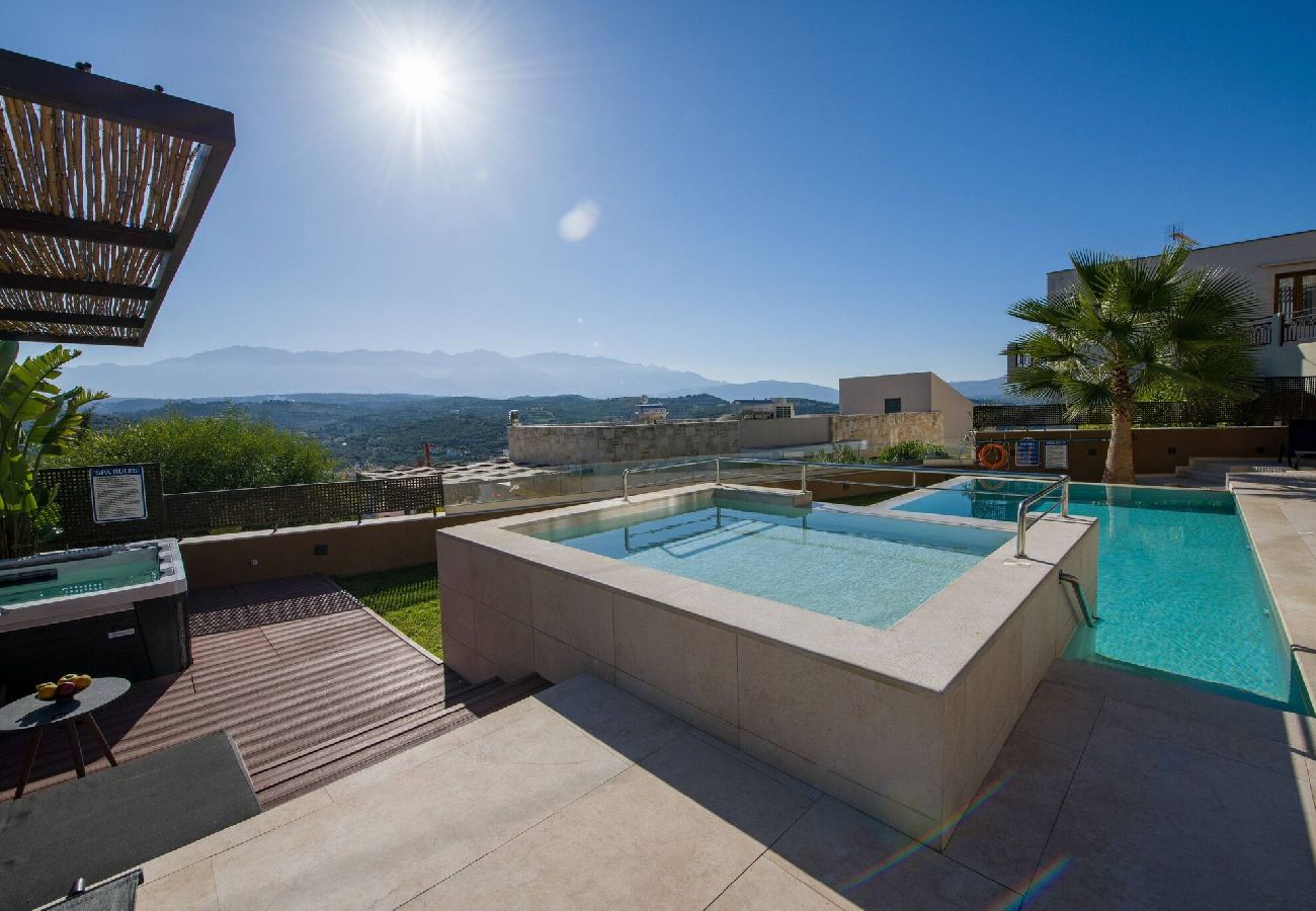Infinity pool with mountain view at Almi Cove Villa II Crete