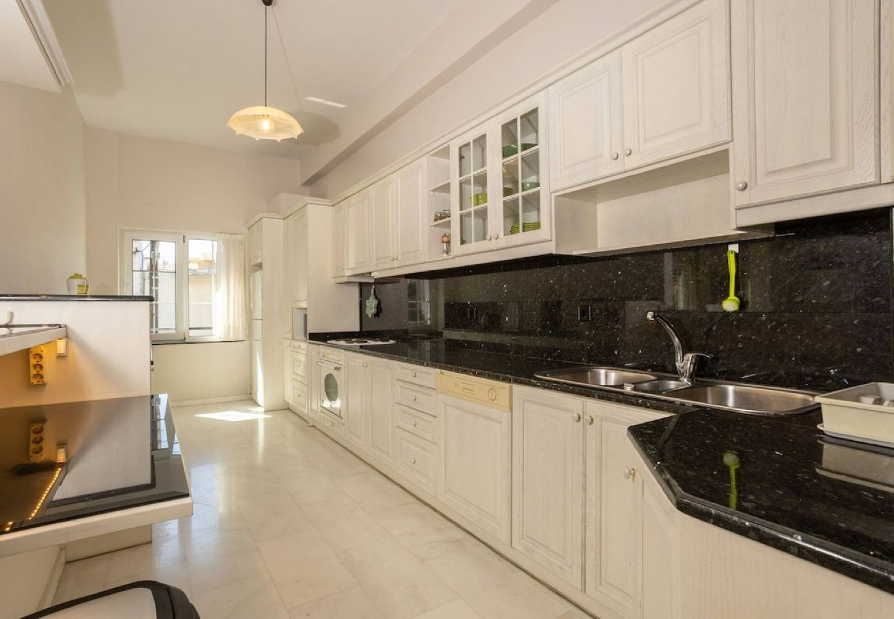 Luxury kitchen with marble and granite finishes in Chania apartment