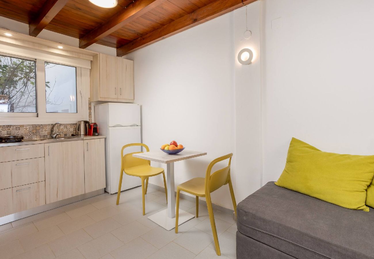 Living area and kitchenette in Xamoudochori maisonette
