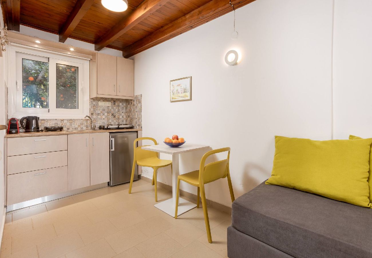 Open plan living room and kitchenette in Crete maisonette