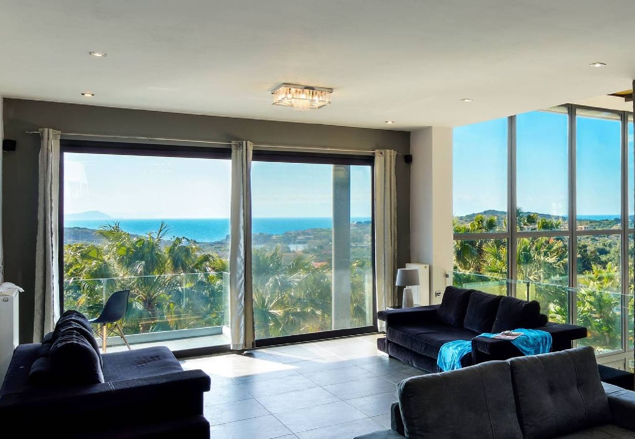 Modern living room with sea view in Tersanas luxury villa