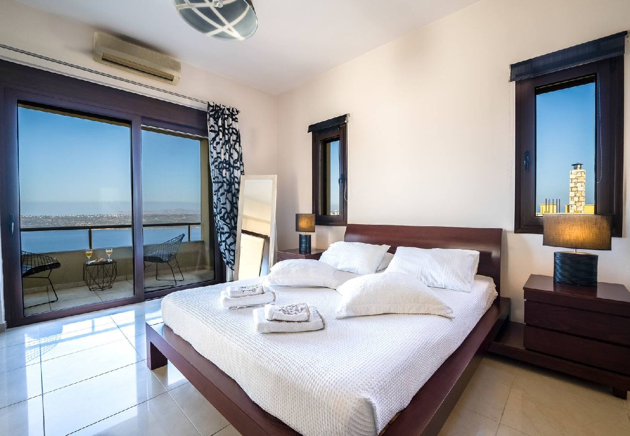 Master bedroom with sea view in luxury villa Souda Bay